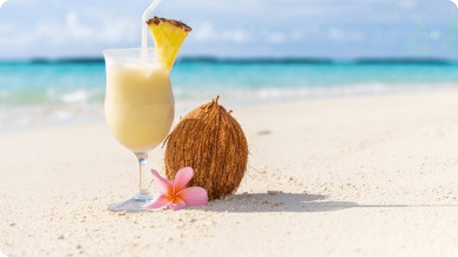 pina-colada-cocktail-on-beach-260nw-506813011 1
